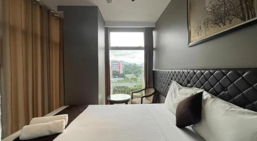 Bed in Capitol Central Hotel and Suites