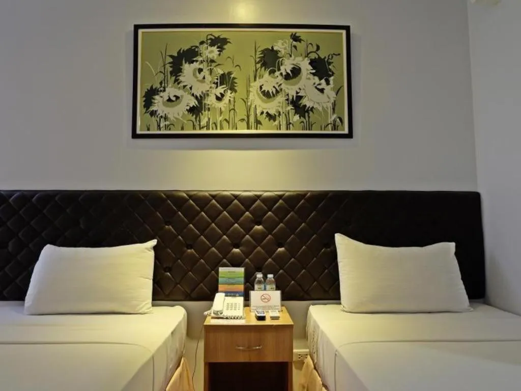 Bed in Capitol Central Hotel and Suites