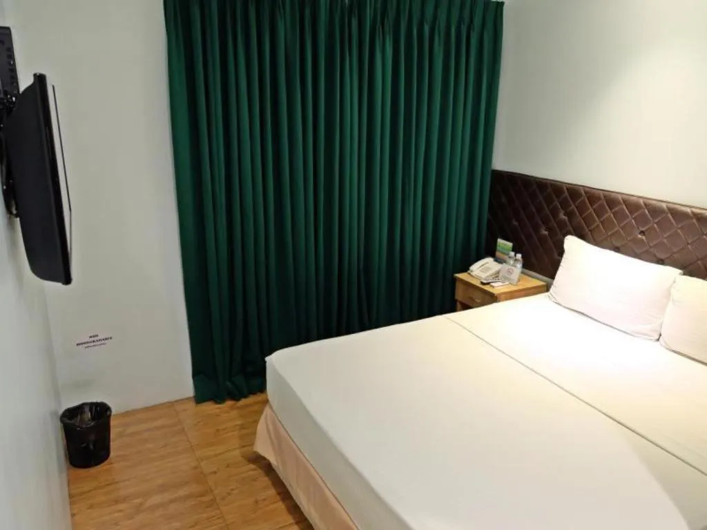 Bed in Capitol Central Hotel and Suites