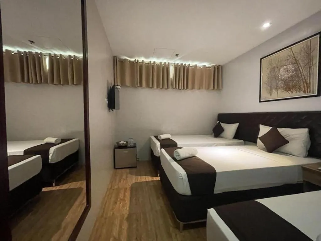 Bed in Capitol Central Hotel and Suites