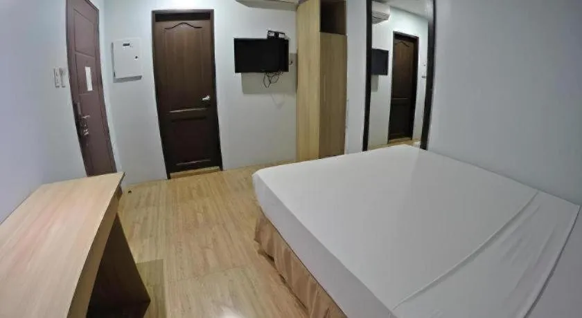 Bed in Capitol Central Hotel and Suites