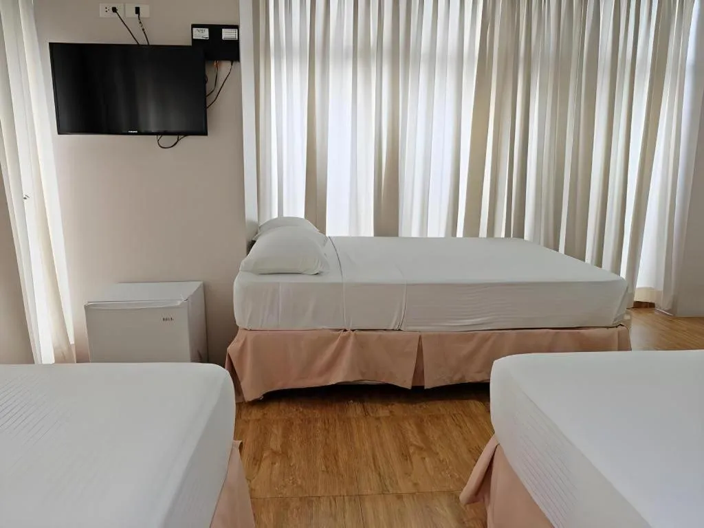 Bed in Capitol Central Hotel and Suites