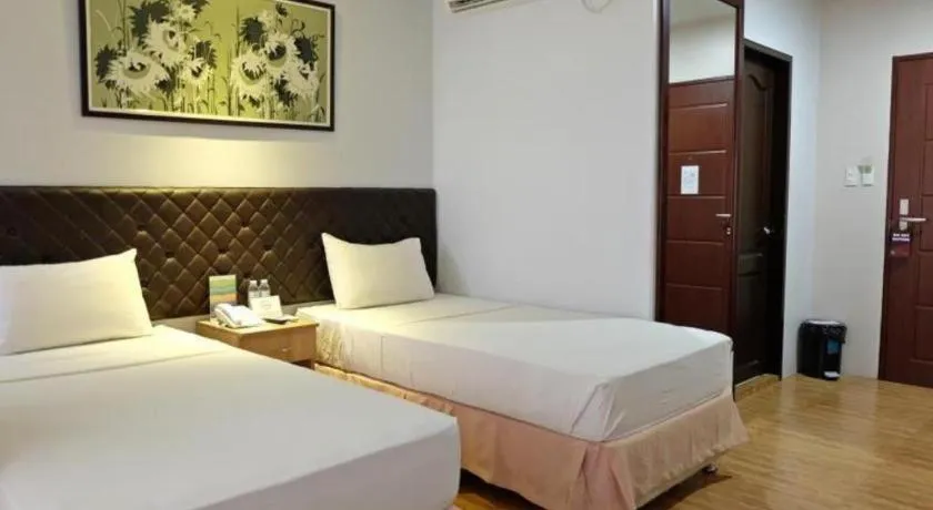 Bed in Capitol Central Hotel and Suites