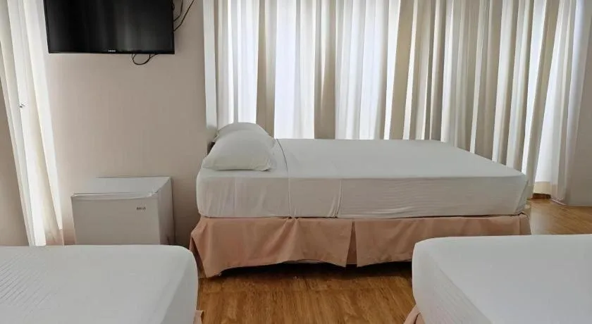 Bed in Capitol Central Hotel and Suites