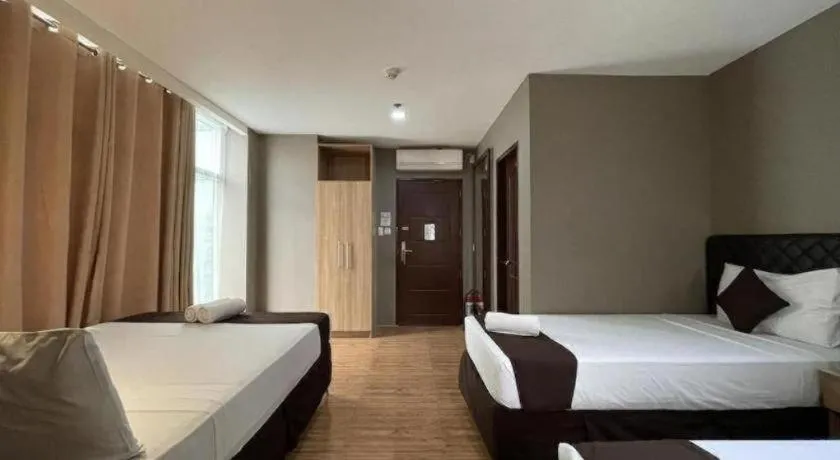 Bed in Capitol Central Hotel and Suites