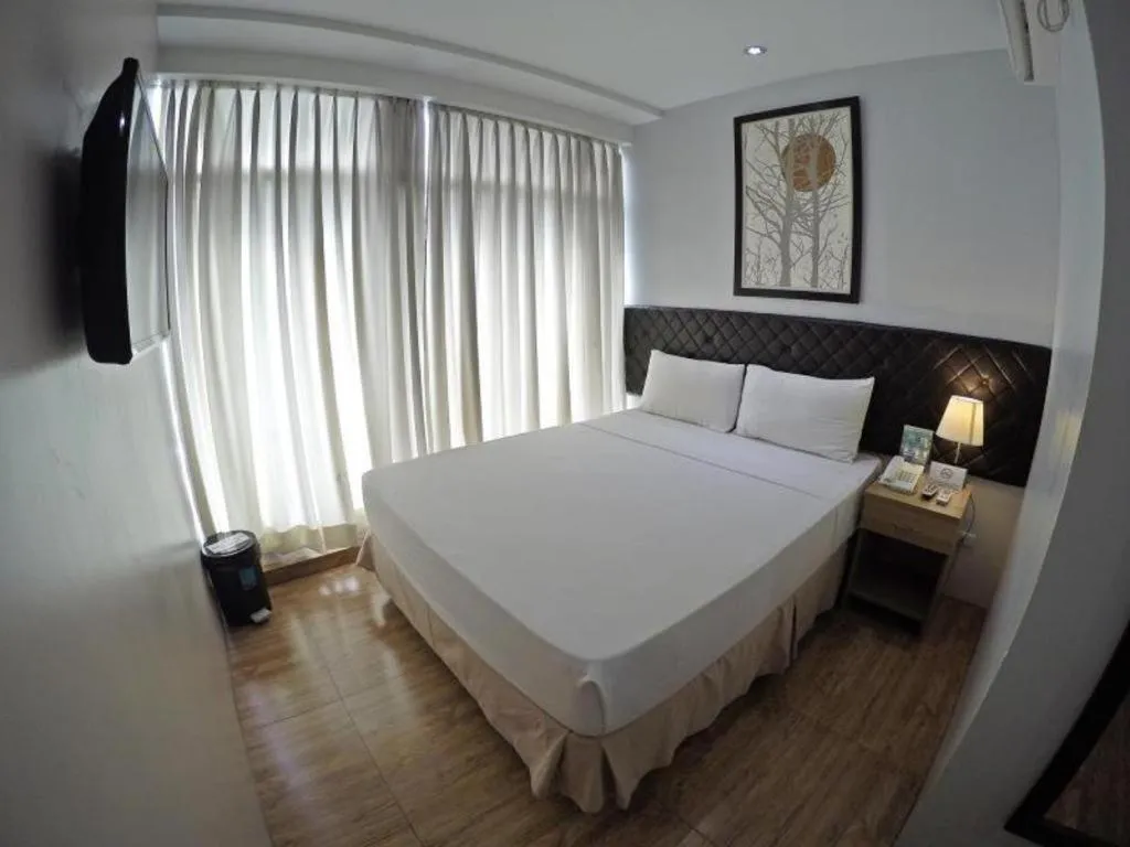 Bed in Capitol Central Hotel and Suites