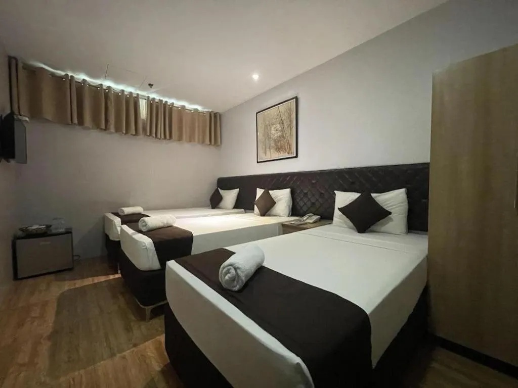 Bed in Capitol Central Hotel and Suites