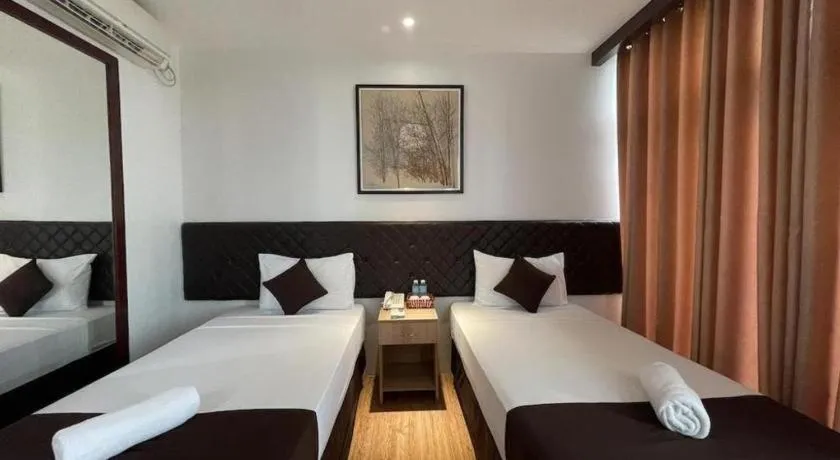 Bed in Capitol Central Hotel and Suites