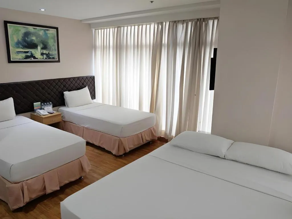 Bed in Capitol Central Hotel and Suites