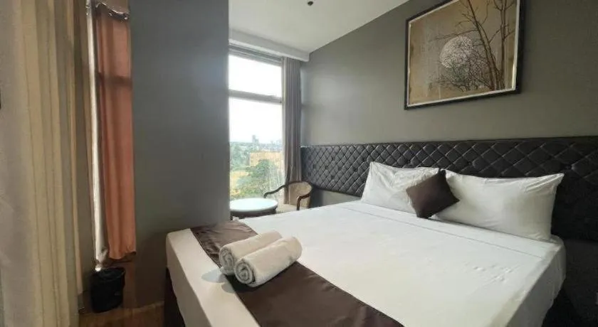 Bed in Capitol Central Hotel and Suites