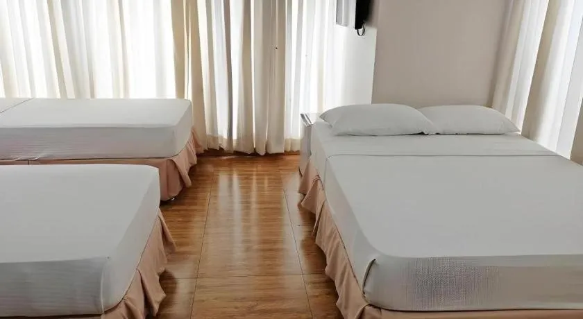 Bed in Capitol Central Hotel and Suites