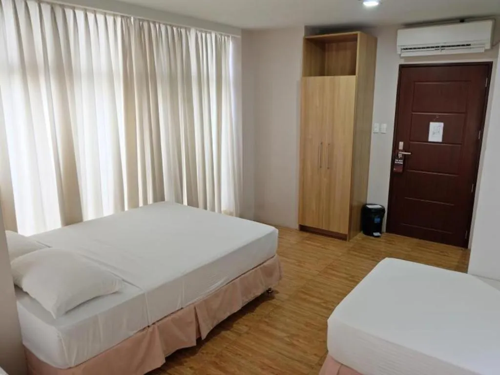 Bed in Capitol Central Hotel and Suites