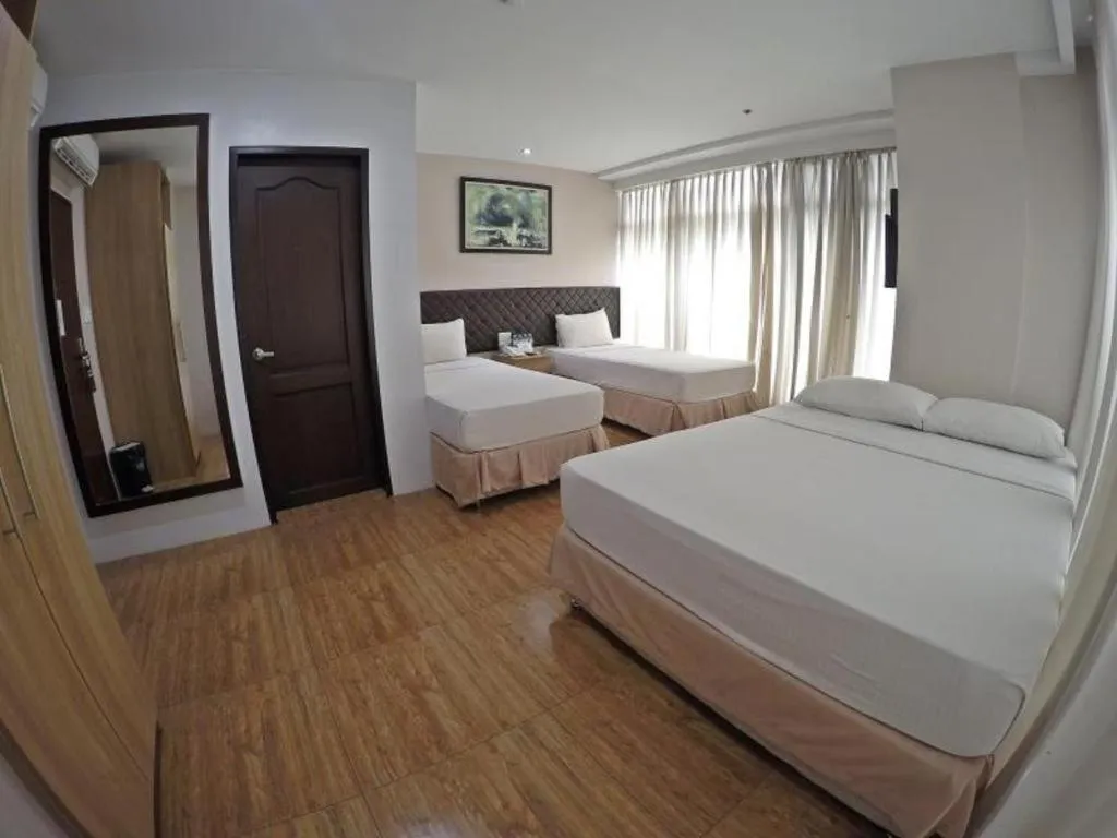 Bed in Capitol Central Hotel and Suites