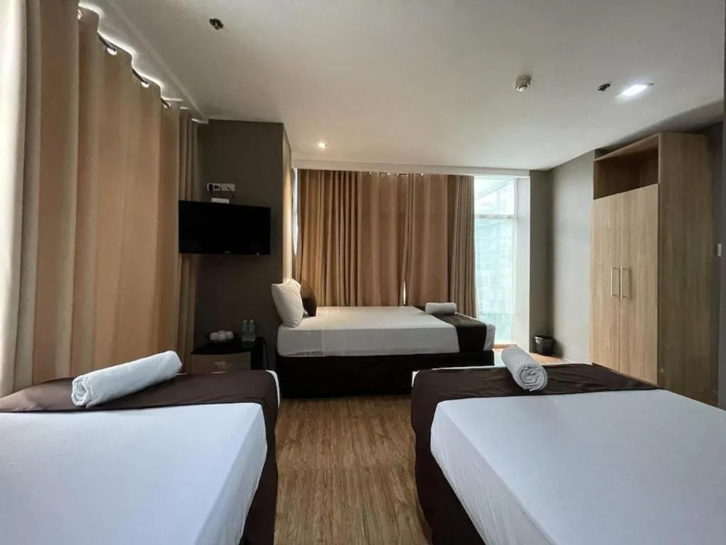 Bed in Capitol Central Hotel and Suites