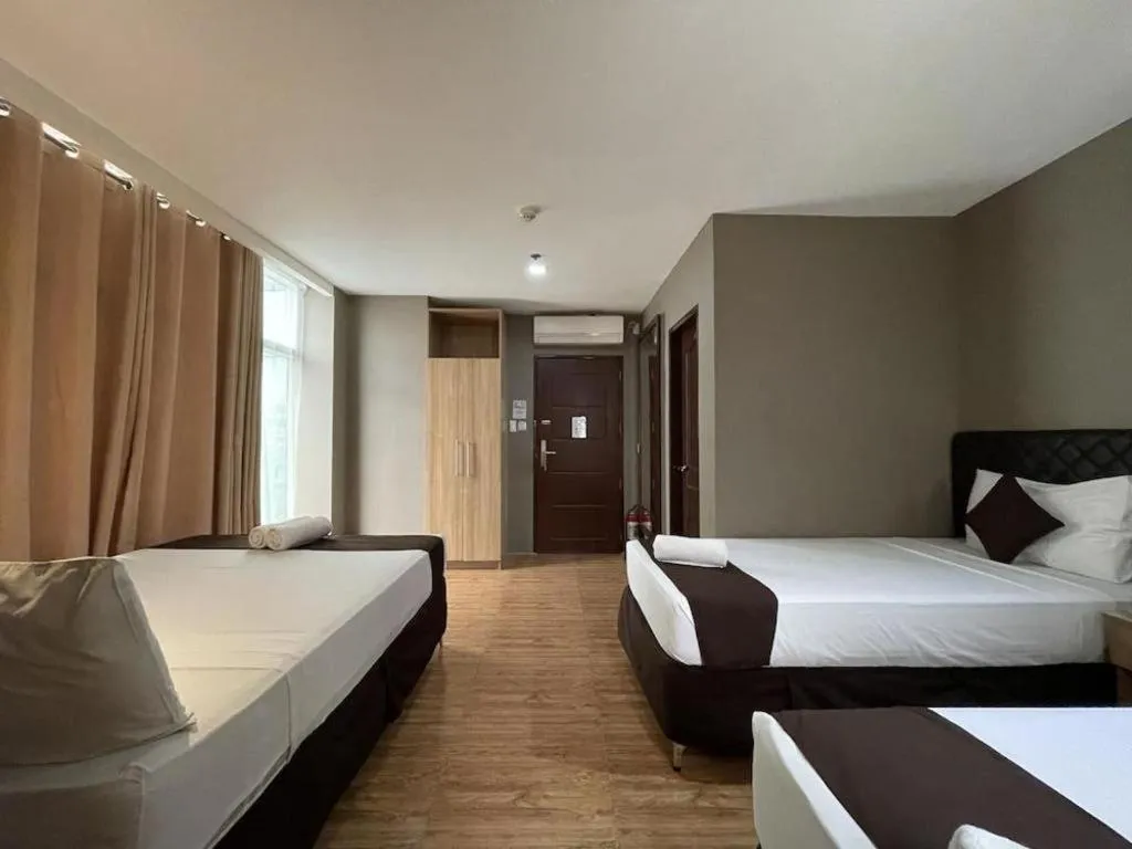 Bed in Capitol Central Hotel and Suites