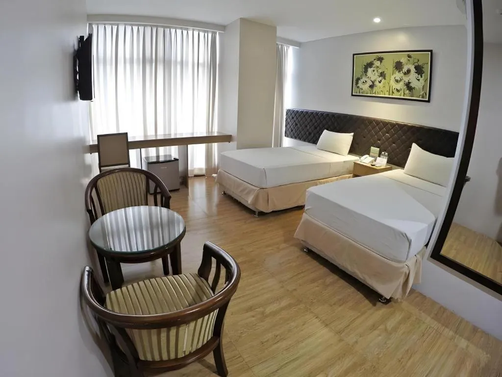 Bed in Capitol Central Hotel and Suites