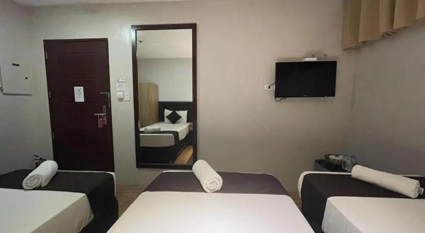 Bed in Capitol Central Hotel and Suites