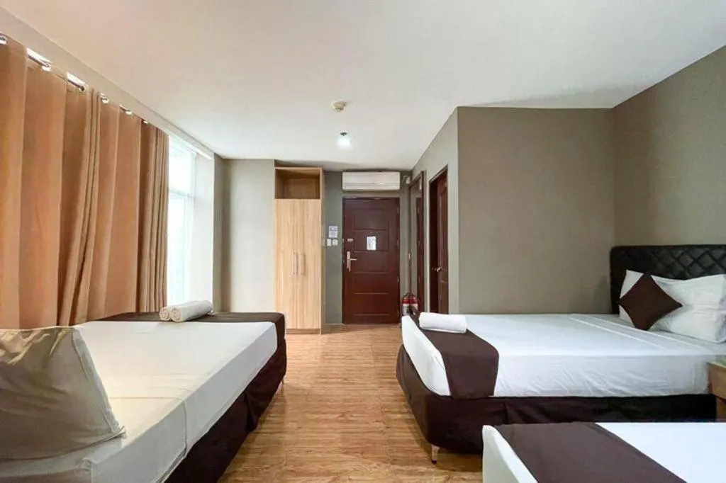 Bed in Capitol Central Hotel and Suites