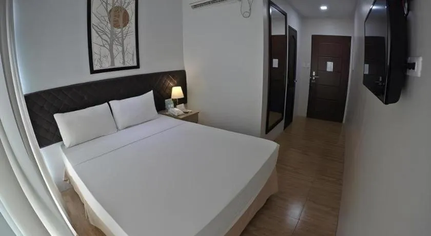 Bed in Capitol Central Hotel and Suites