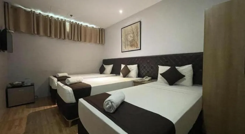 Bed in Capitol Central Hotel and Suites