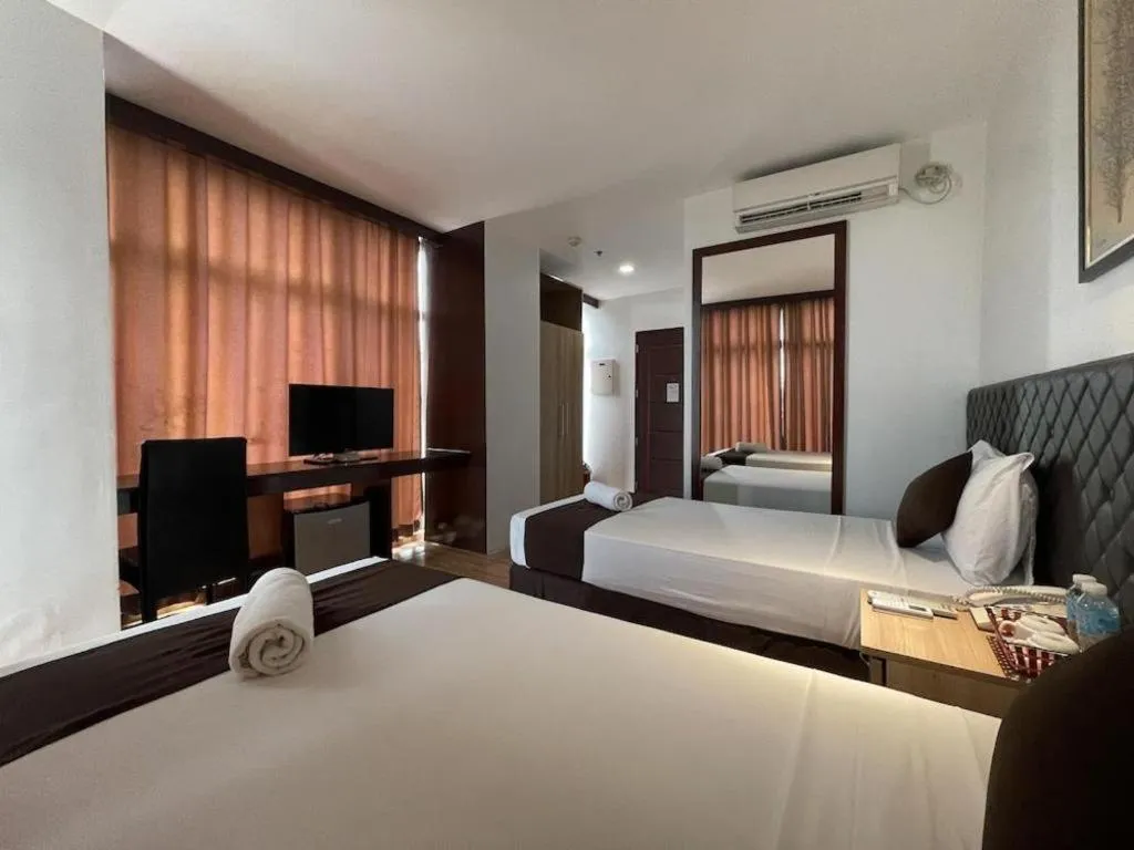 Bed in Capitol Central Hotel and Suites