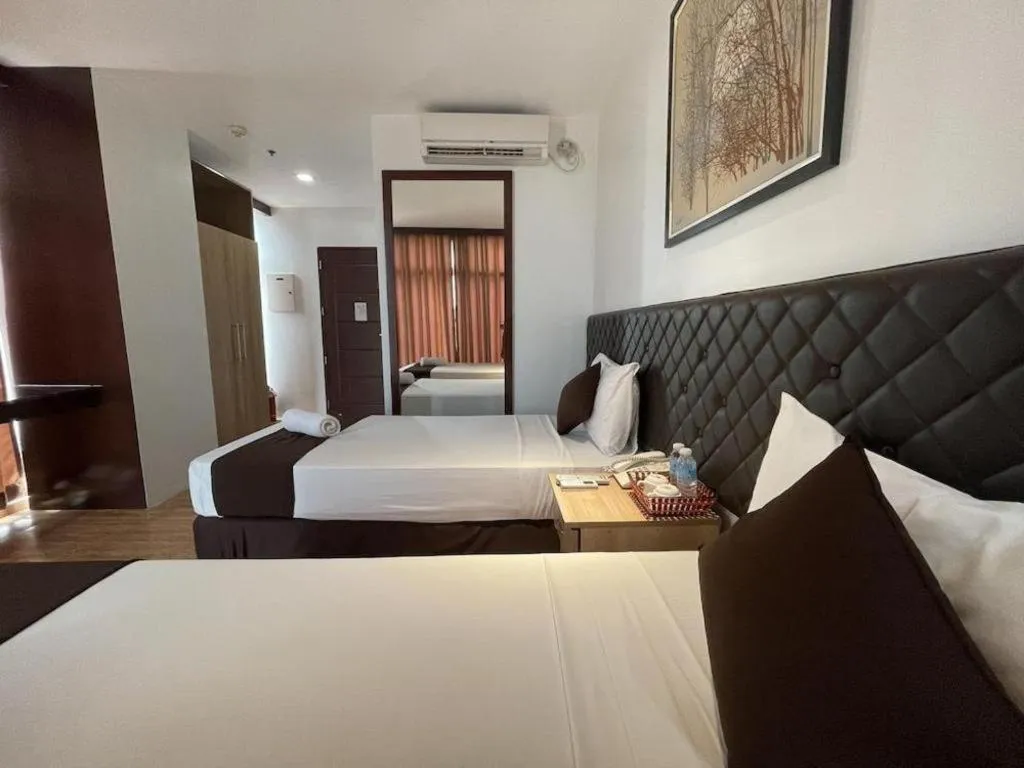 Bed in Capitol Central Hotel and Suites