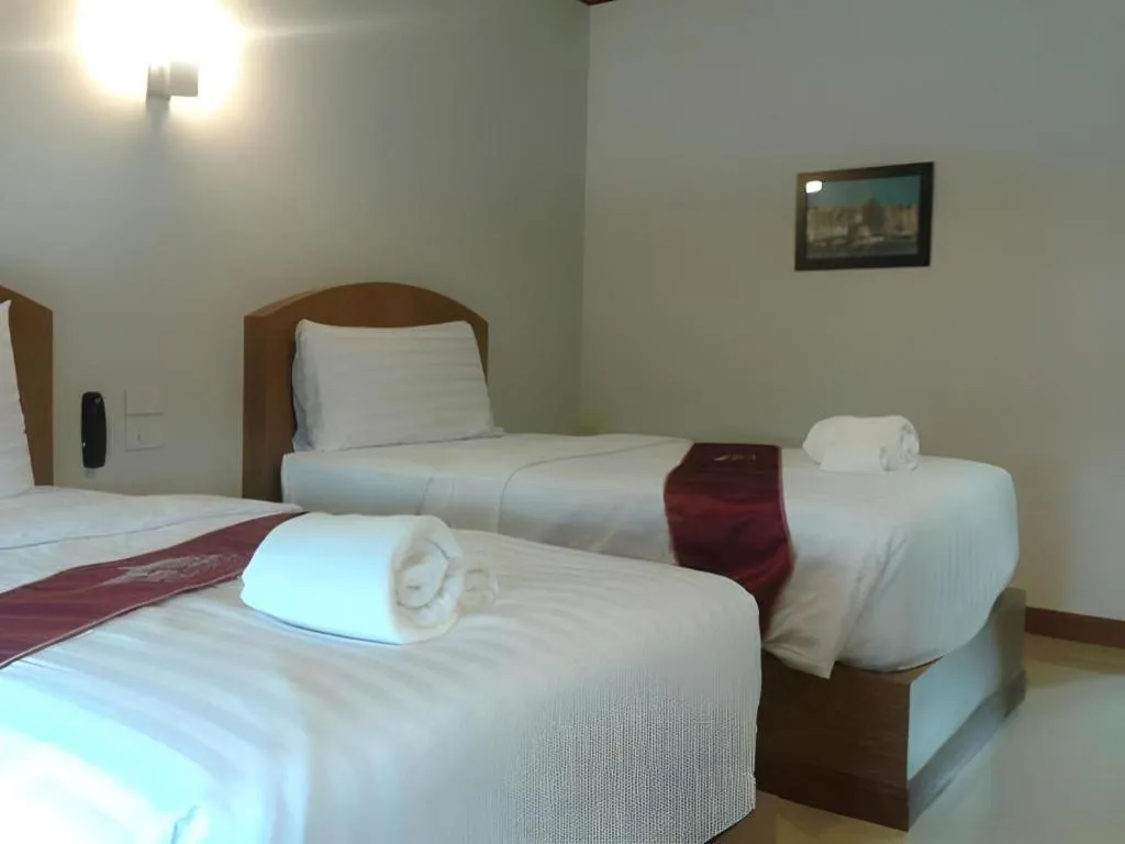 Bed in Thada Chateau Hotel