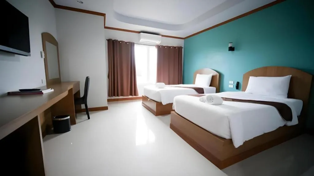 Bed in Thada Chateau Hotel