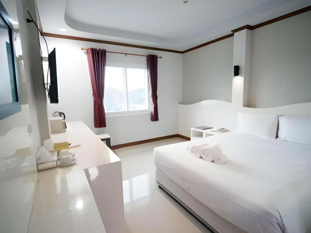 Bed in Thada Chateau Hotel