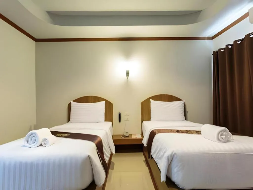 Bed in Thada Chateau Hotel