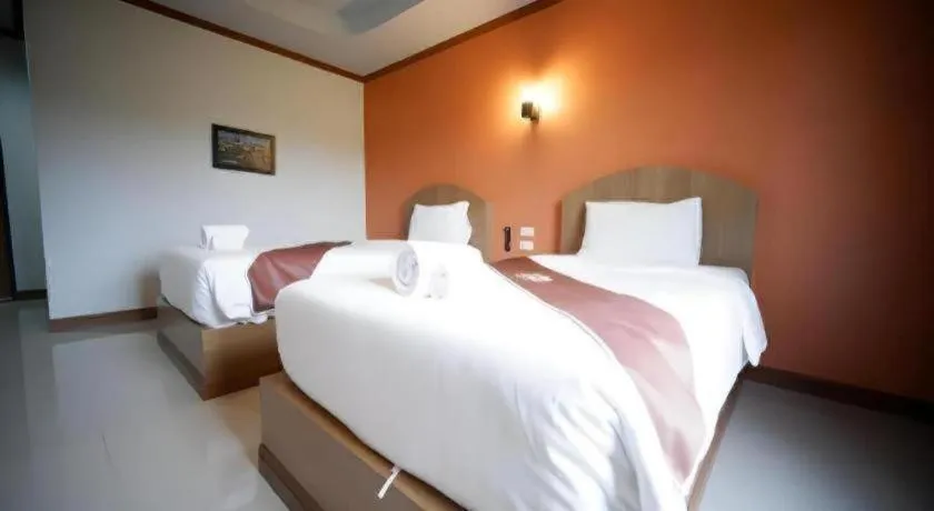 Bed in Thada Chateau Hotel