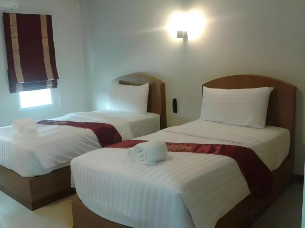 Bed in Thada Chateau Hotel