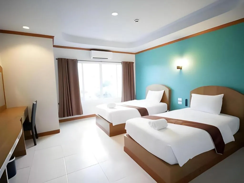 Bed in Thada Chateau Hotel