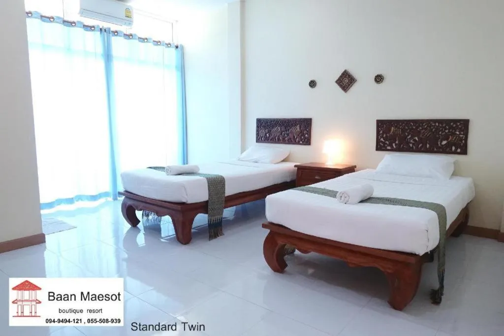 Bed in Baan Maesot Boutique Resort