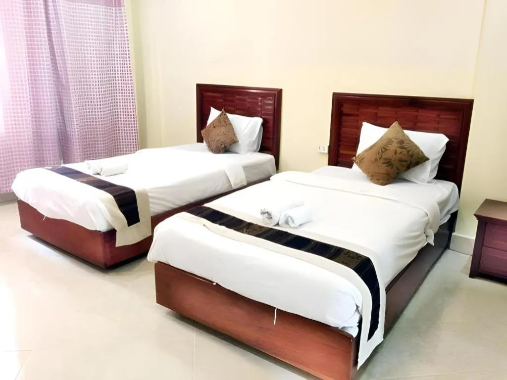 Bed in New Rose Boutique Hotel