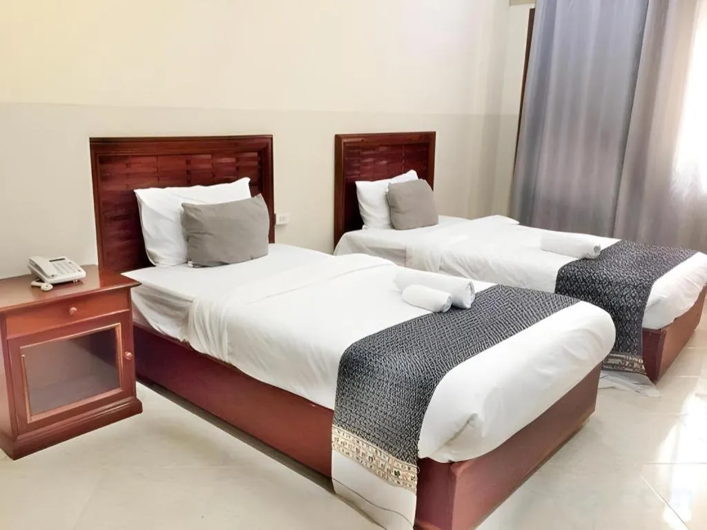 Bed in New Rose Boutique Hotel