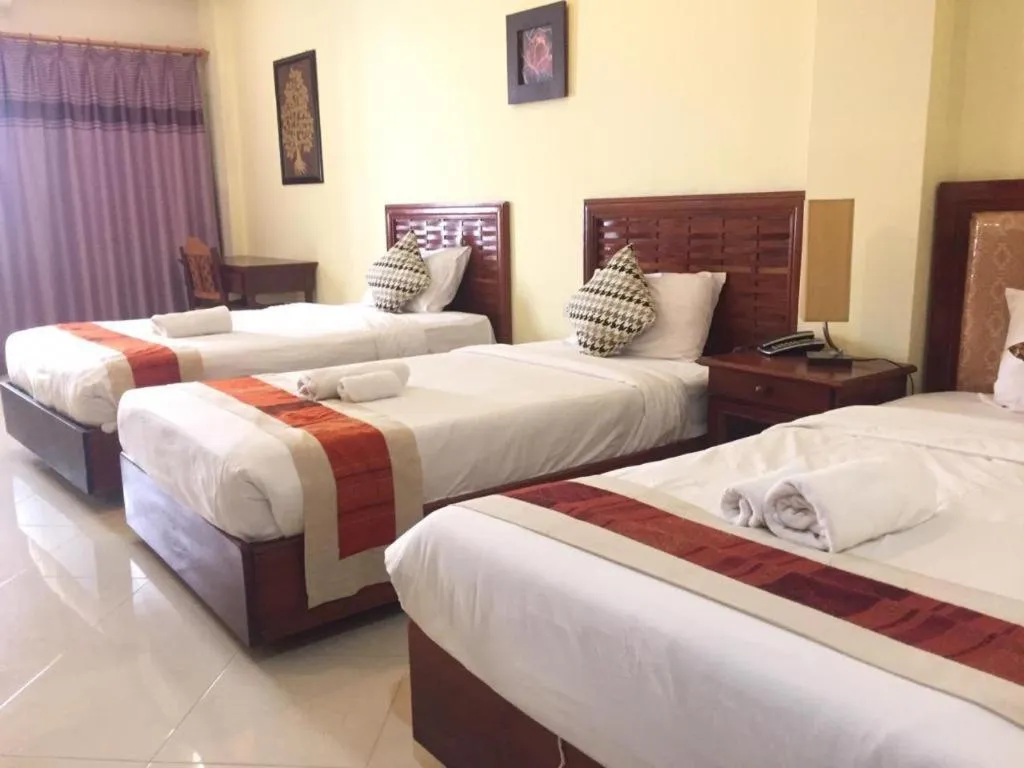 Bed in New Rose Boutique Hotel