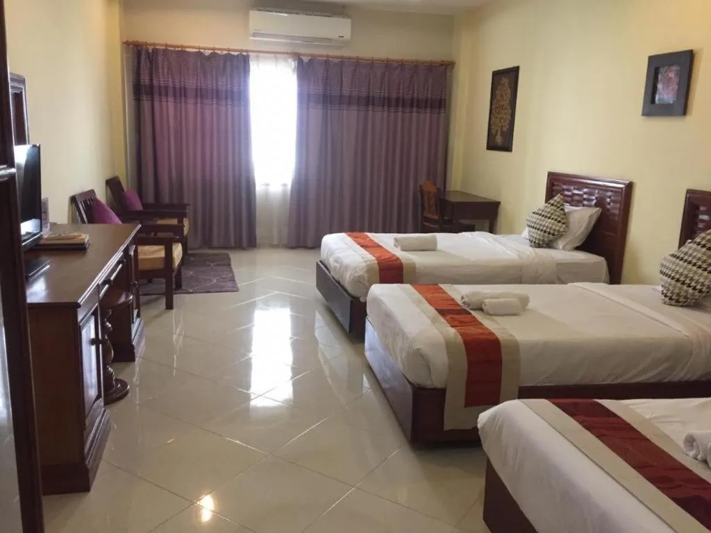 Bed in New Rose Boutique Hotel