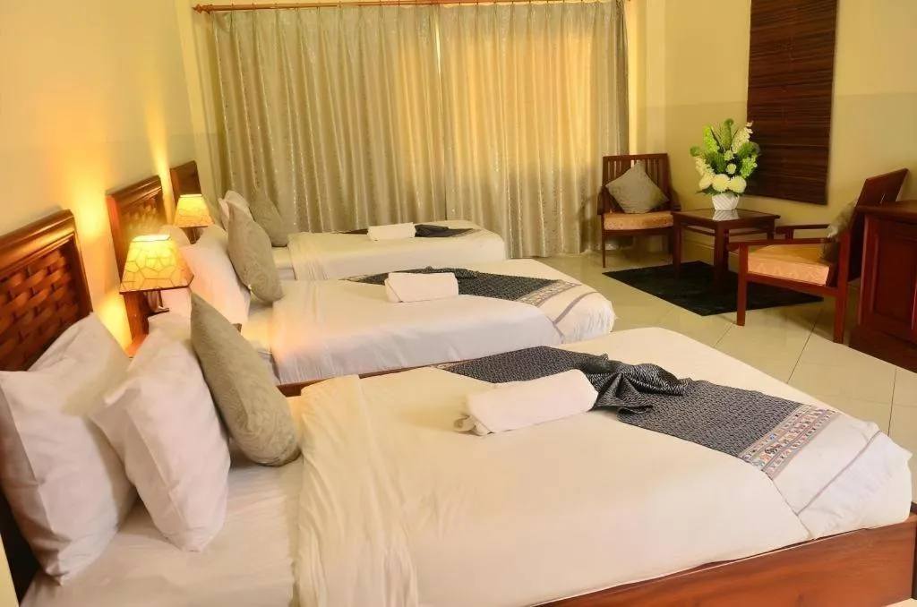 Bed in New Rose Boutique Hotel