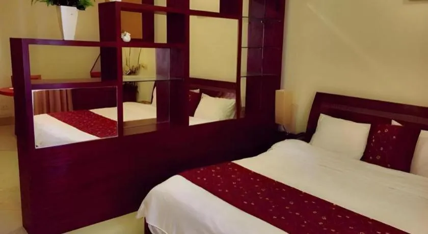 Bed in New Rose Boutique Hotel