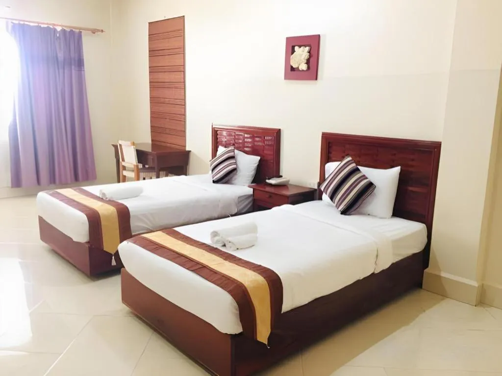 Bed in New Rose Boutique Hotel