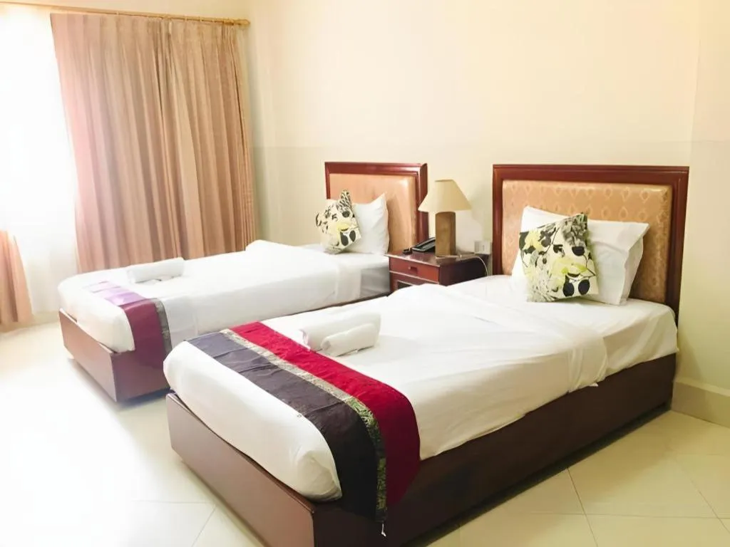 Bed in New Rose Boutique Hotel