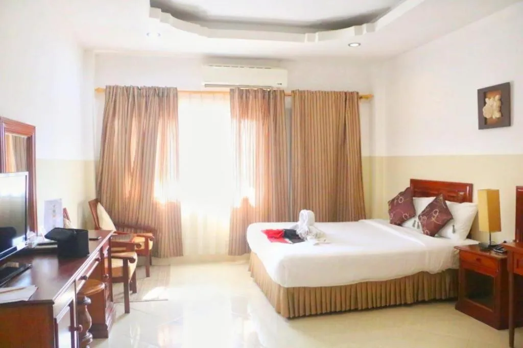 Bed in New Rose Boutique Hotel