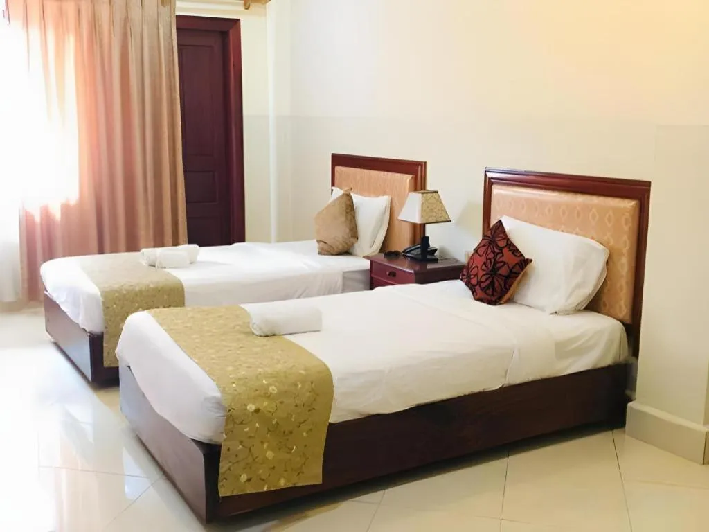 Bed in New Rose Boutique Hotel