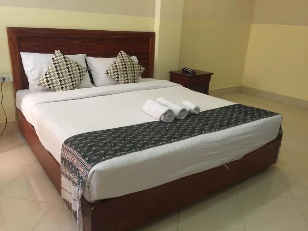 Bed in New Rose Boutique Hotel