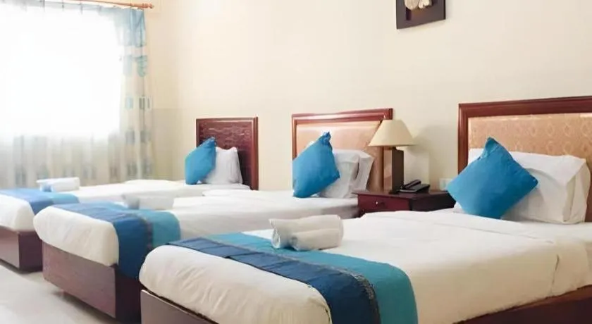 Bed in New Rose Boutique Hotel