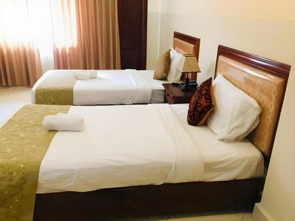 Bed in New Rose Boutique Hotel