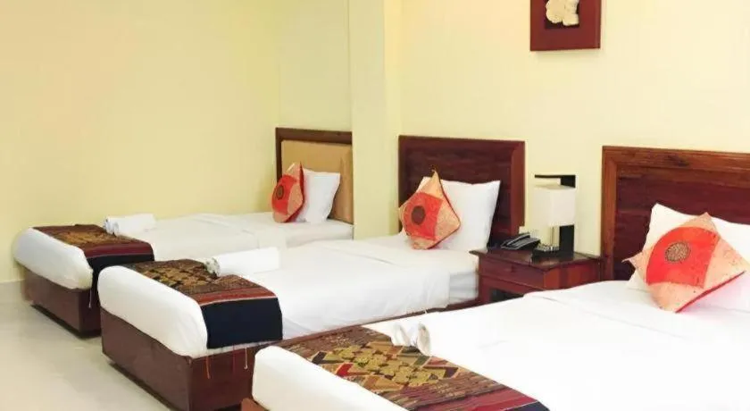 Bed in New Rose Boutique Hotel