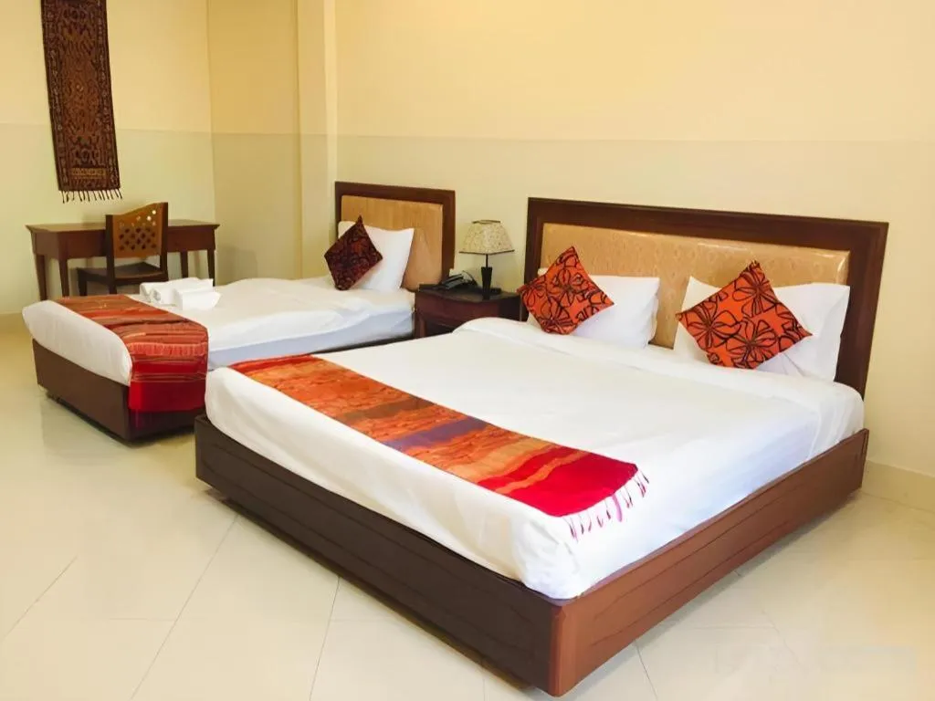 Bed in New Rose Boutique Hotel