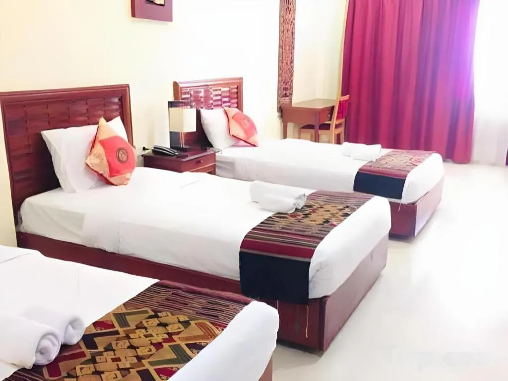 Bed in New Rose Boutique Hotel